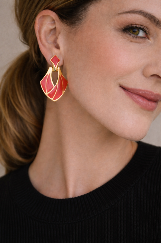 Vintage 1980s Deco style magenta earrings, styled on model. 