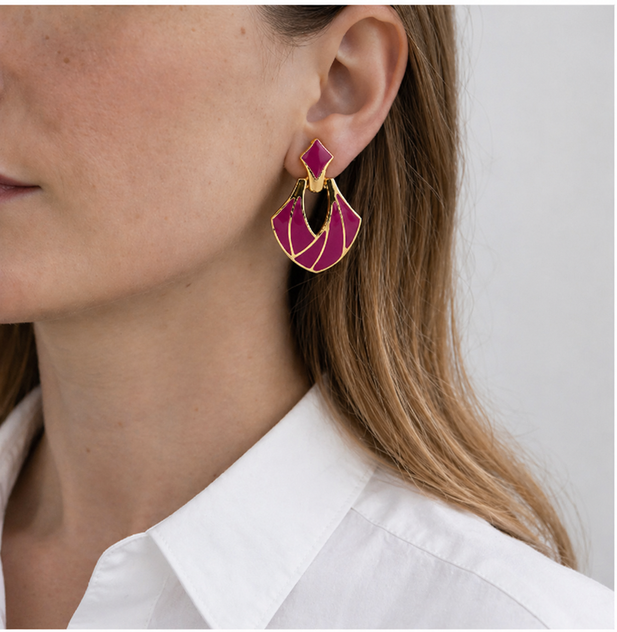 1980s Deco Style Magenta Earrings styled with a white shirt. 