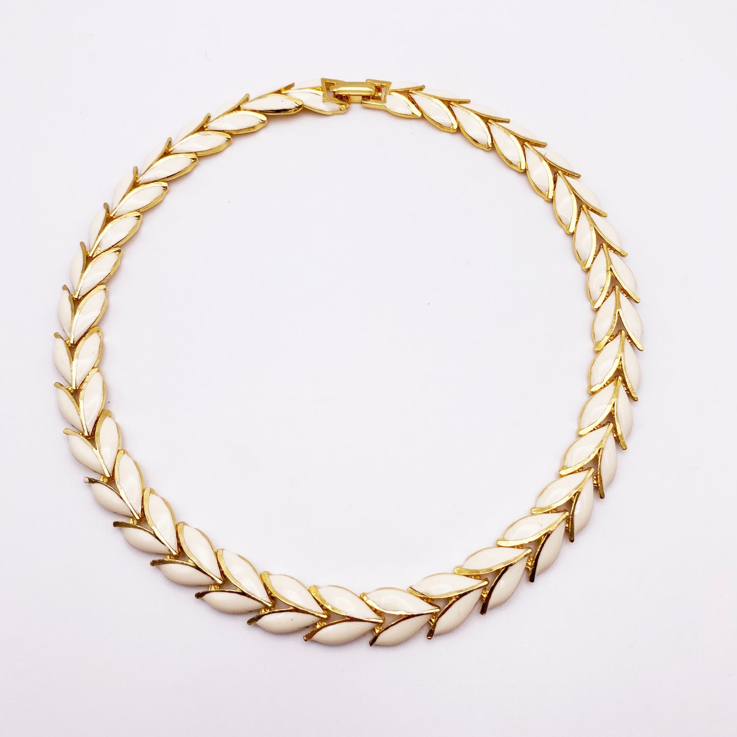 1980s Enamel Leaf Collar Necklace on white background.