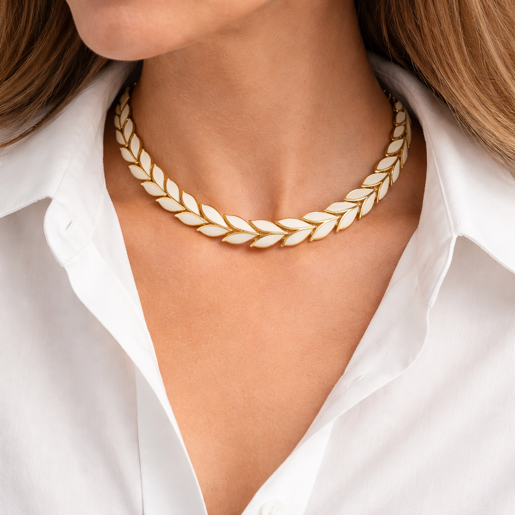1980s Enamel leaf necklace, styled on a crisp white shirt.