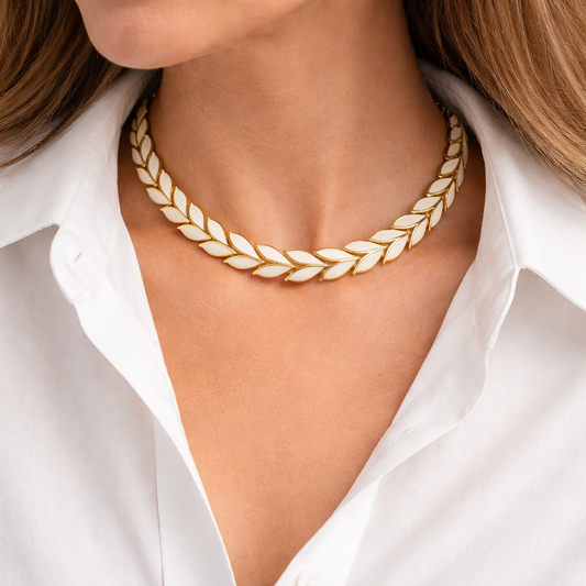 1980s Enamel leaf necklace, styled on a crisp white shirt.