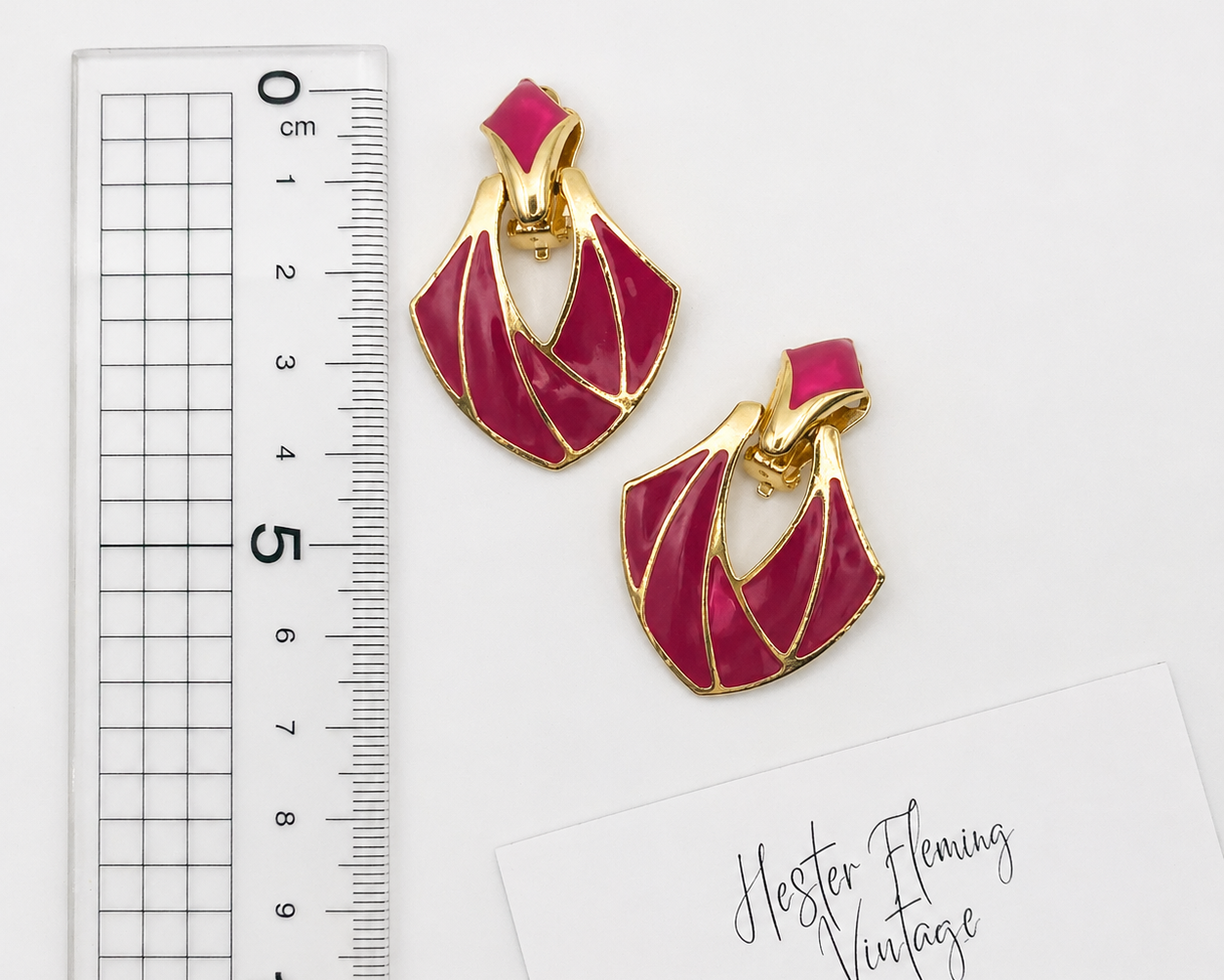 1980s Magneta Deco Style Earrings, placed next to a ruler for measurement. 