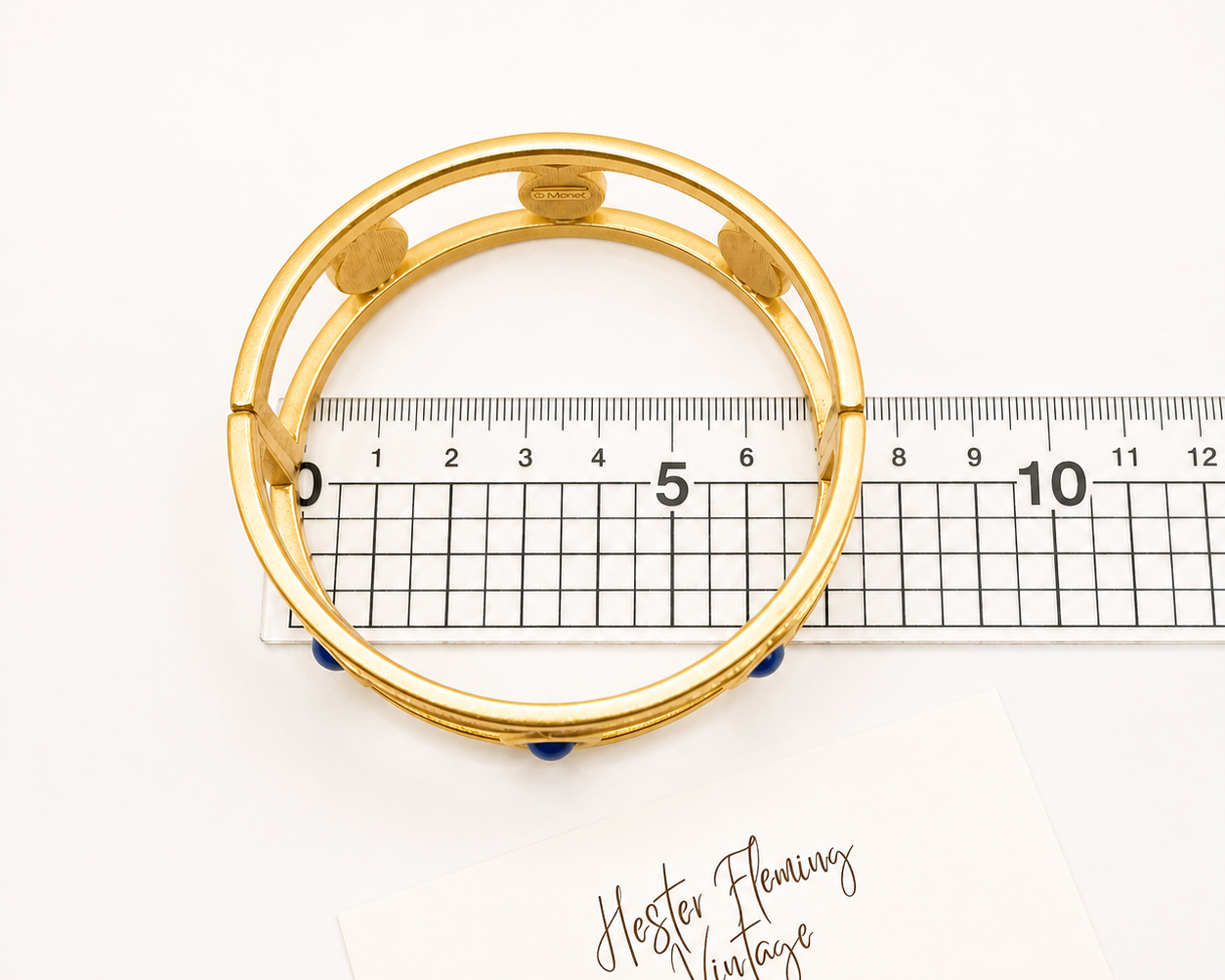 1980s Monet Bangle, placed on ruler for measurement.