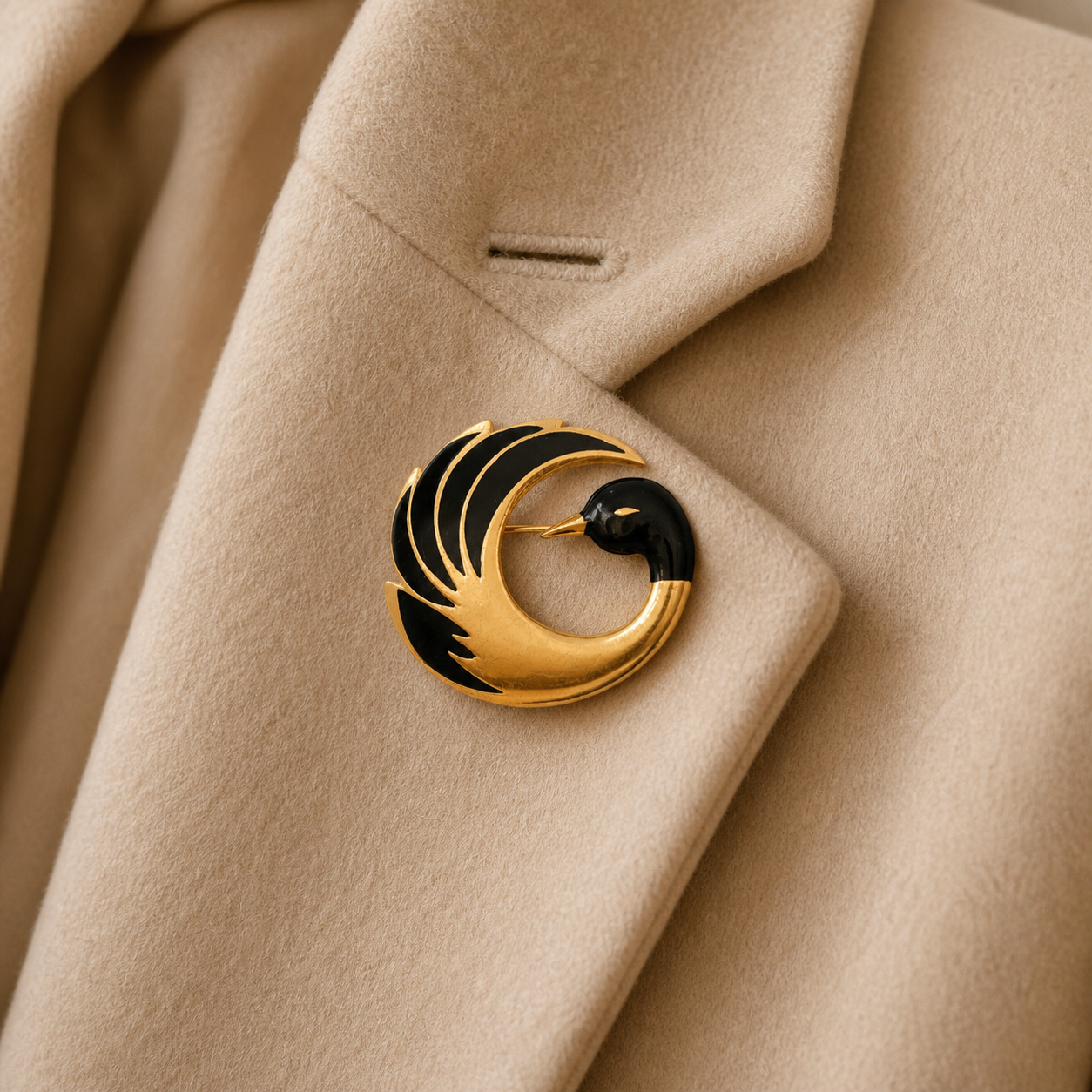 1980s Orena Paris Swan Brooch, styled on a cream cashmere jacket.