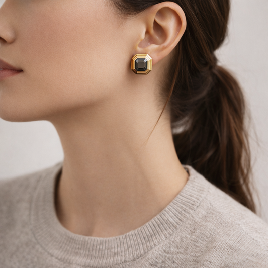 Vintage 1980s Vintage Lanvin earrings, styled on a model, wearing a grey knit. 