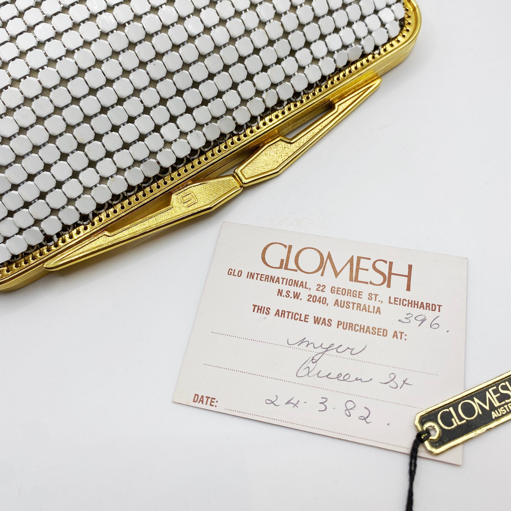 Original 1982 Glomesh purchase card from Myer Queen Street included with white mesh evening purse