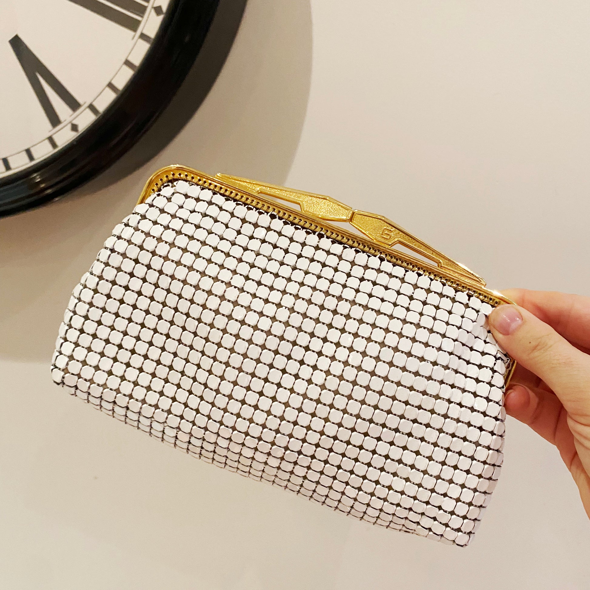 1982 Glomesh white enamel mesh evening purse with gold tone frame and geometric clasp, made in Australia