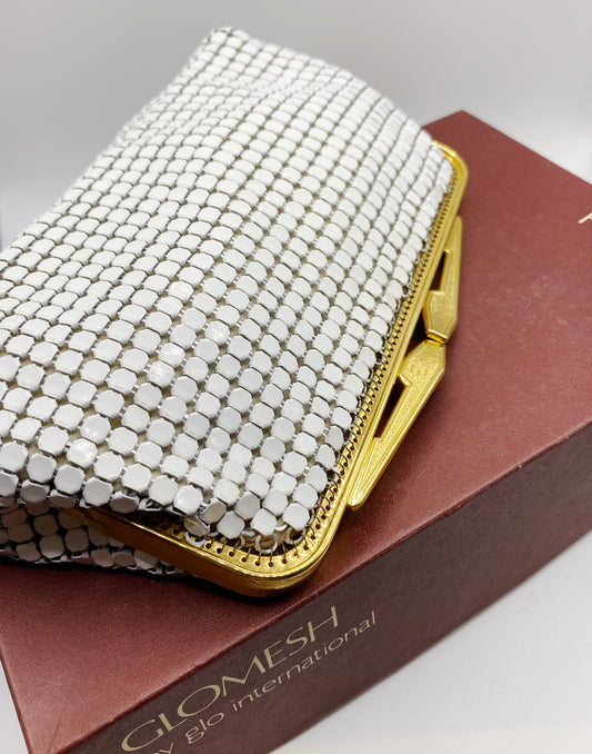 Close-up of white enamel coated Glomesh mesh with polished gold tone frame, early 1980s Australian design. Original box. 