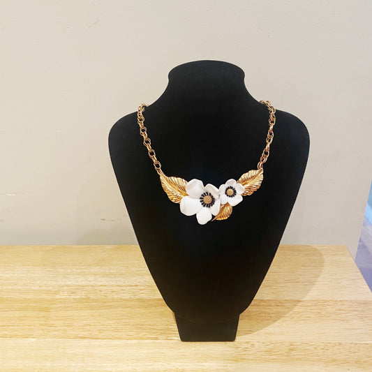 1984 Luis Feraud vintage necklace with white lucite dogwood flower and goldtone metal.