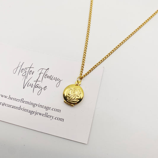 Delicate 1990s miniature gold locket on 46cm chain, perfect for layering
