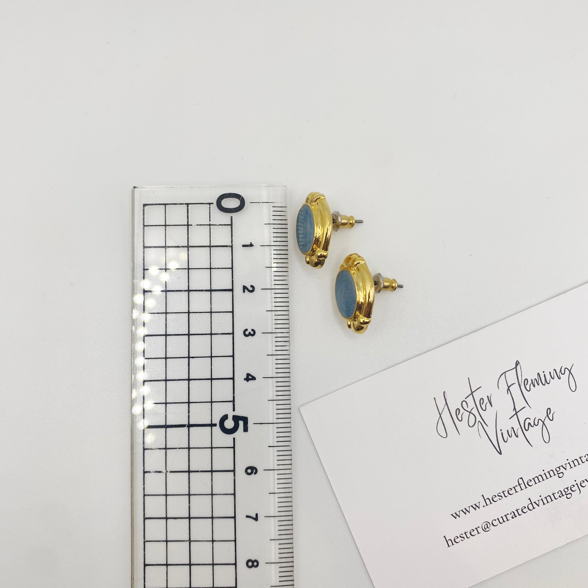 Measurement of vintage blue enamel and gold stud earrings, deadstock from London, 90s era.