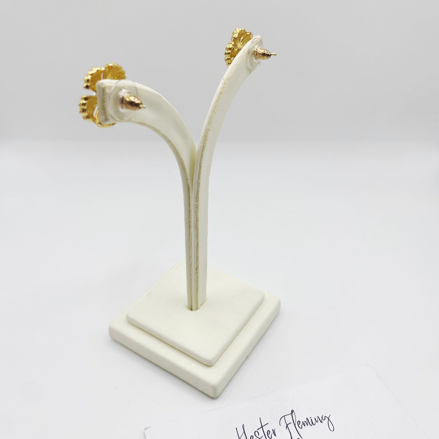 Back view of 1990s gold tone pearl stud earrings