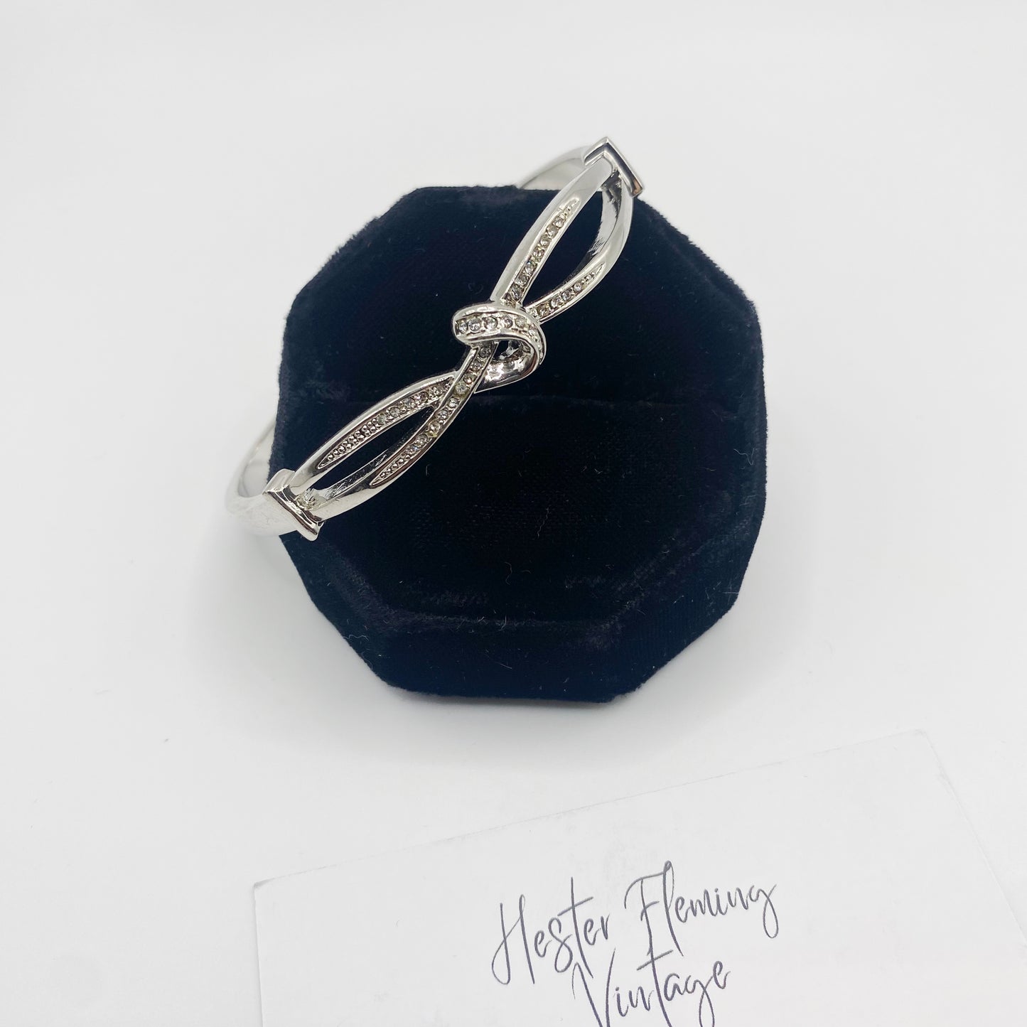 Front view of 1990s silvertone pavé knot bangle