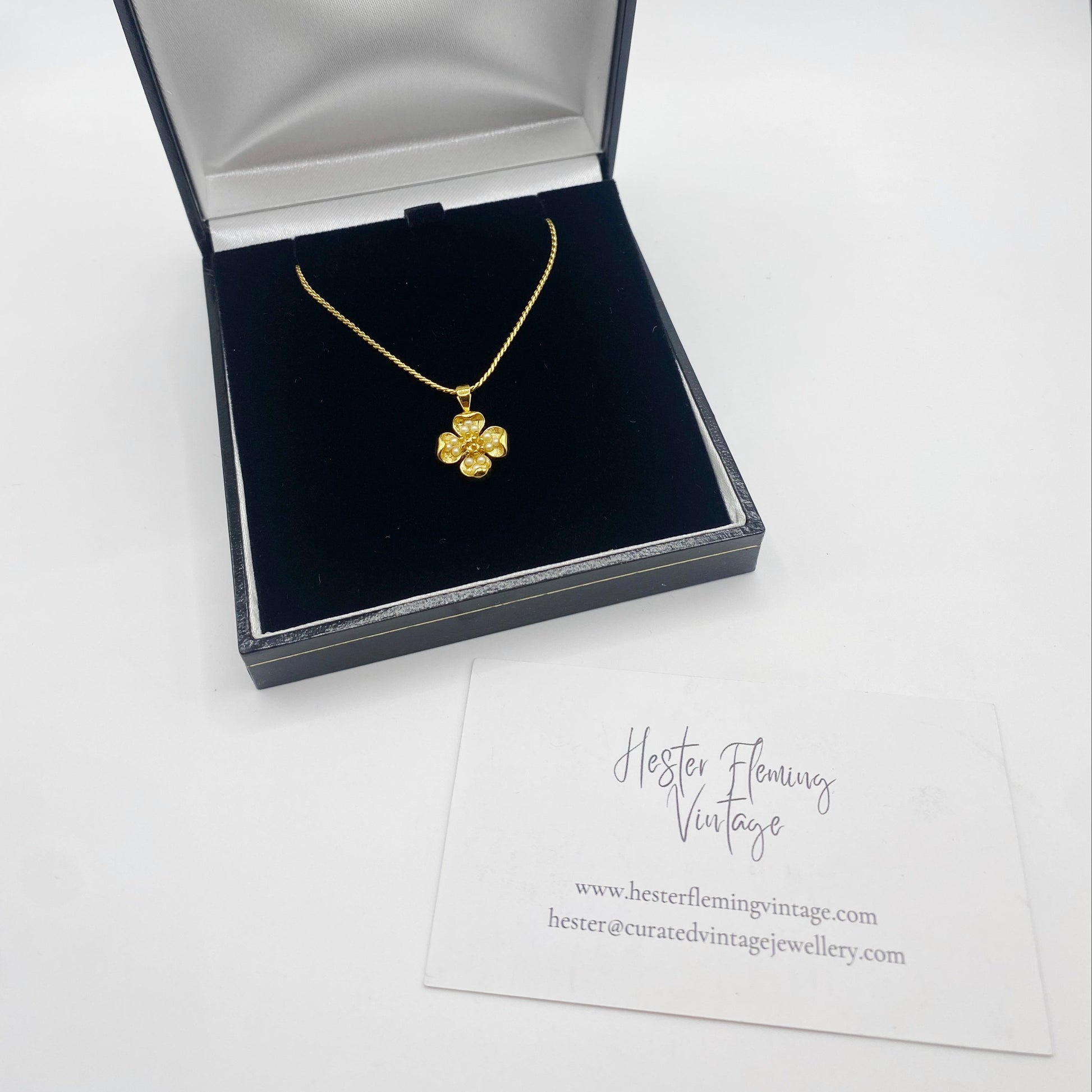 Vintage Trifari floral necklace displayed in presentation box