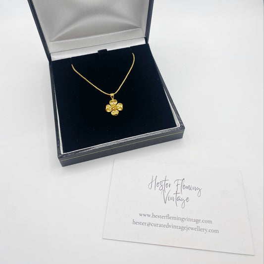 Vintage Trifari floral necklace displayed in presentation box