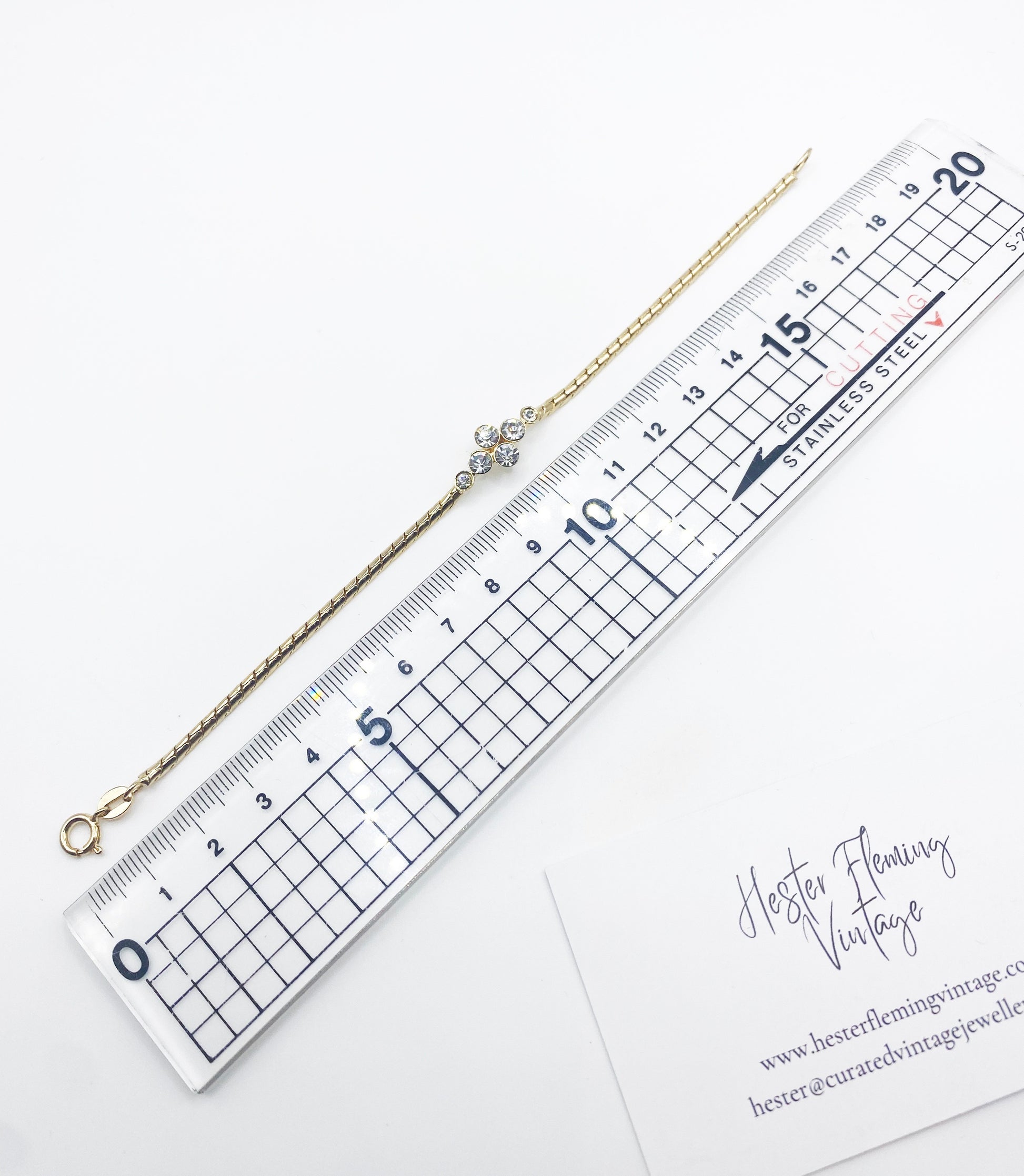 Measurement of Vintage Swarovski crystal bracelet styled on wrist, 1990s gold plated design.