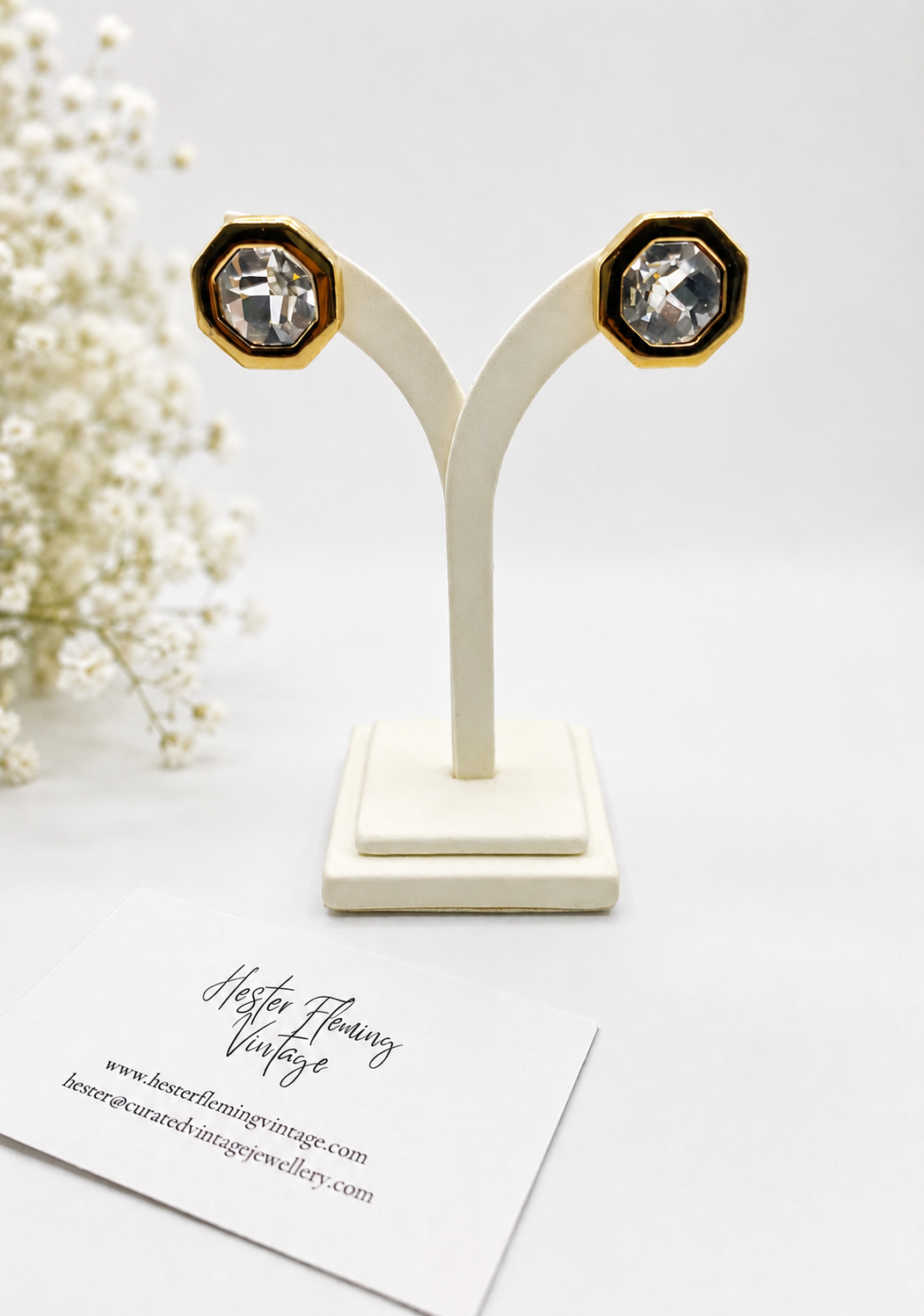 Vintage SAL earrings, presented on an earring stand. 