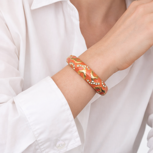 Vintage 1990s Joan Rivers, designer bangle styled with a crisp white shirt.