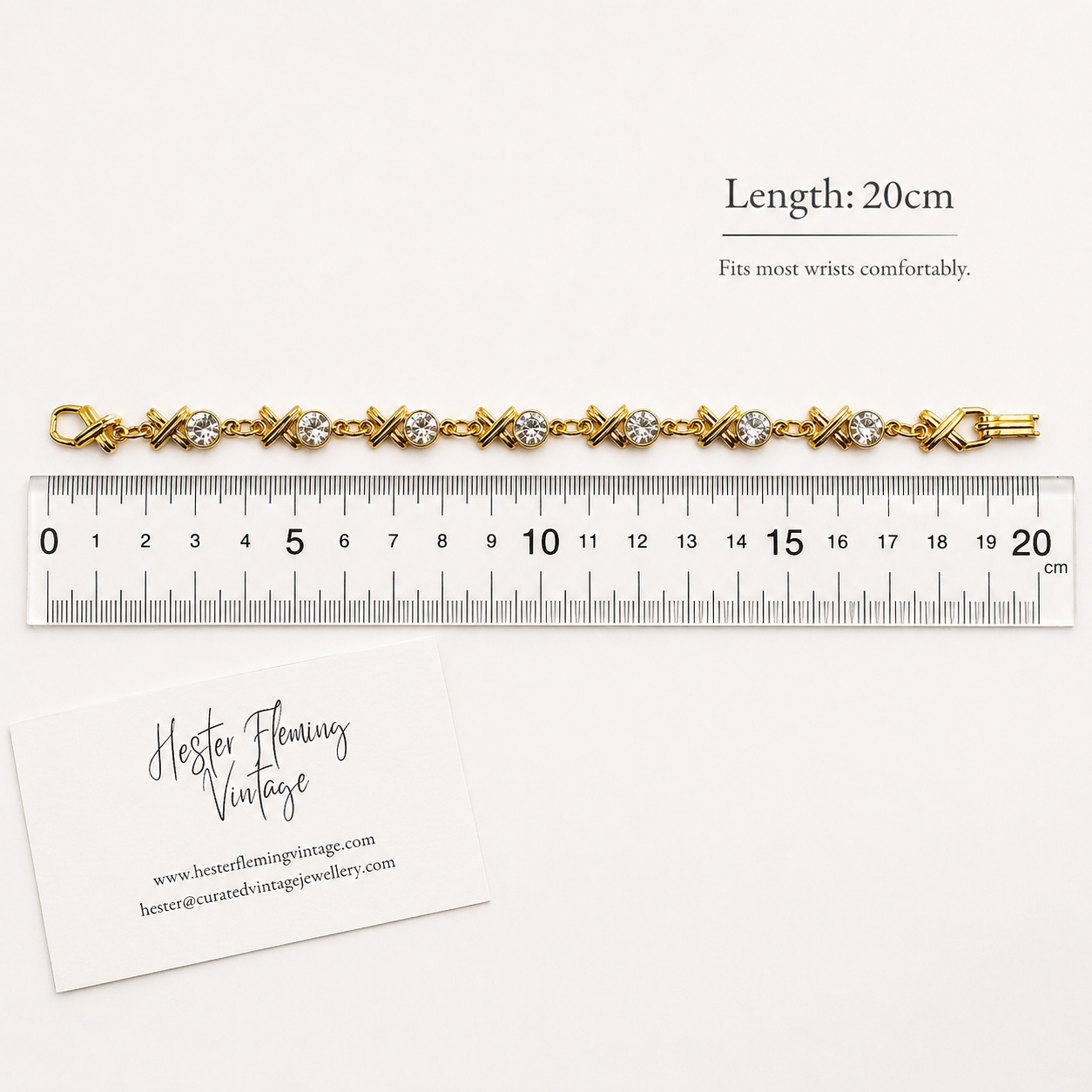 Vintage 1990s XO Swarovski Crystal Bracelet, placed next to a ruler for measurement. 