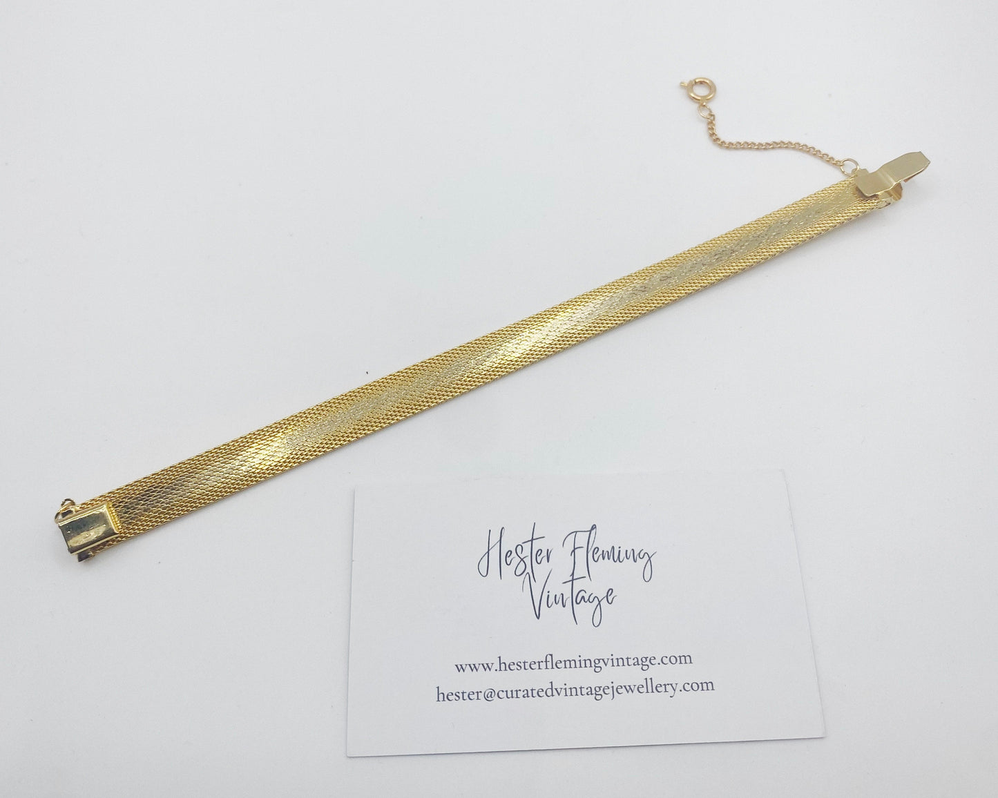 Back view of Vintage 70s gold mesh bracelet. Safety chain included. 