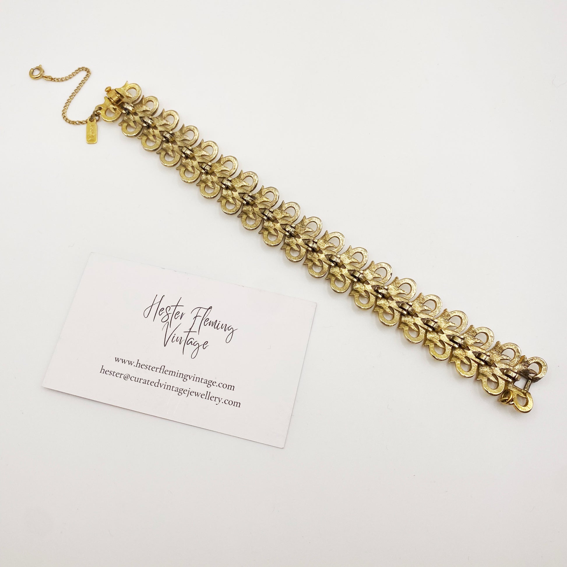 Back of vintage Monet Felicia bracelet, 1969 launch, gold-plated link design with safety chain, 1960s/70s signed collectible jewellery.