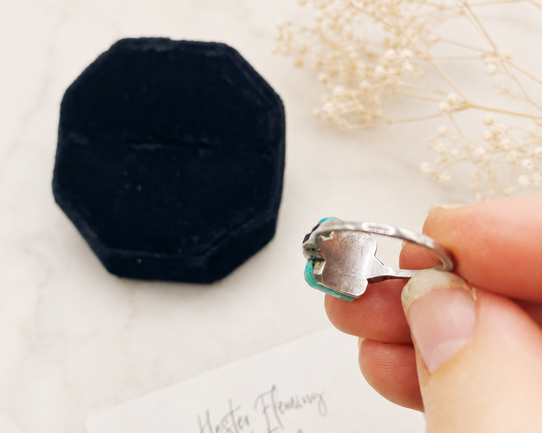 Art Deco Ring back view, held by hand.