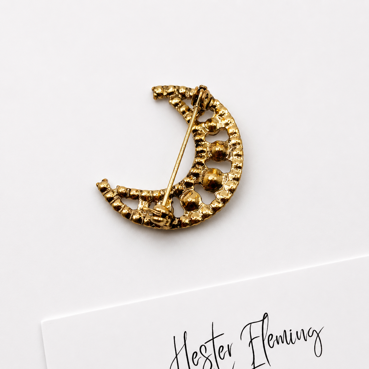 Vintage 90s Crescent Moon Brooch, back of brooch with roll over clasp, goldtone setting.  