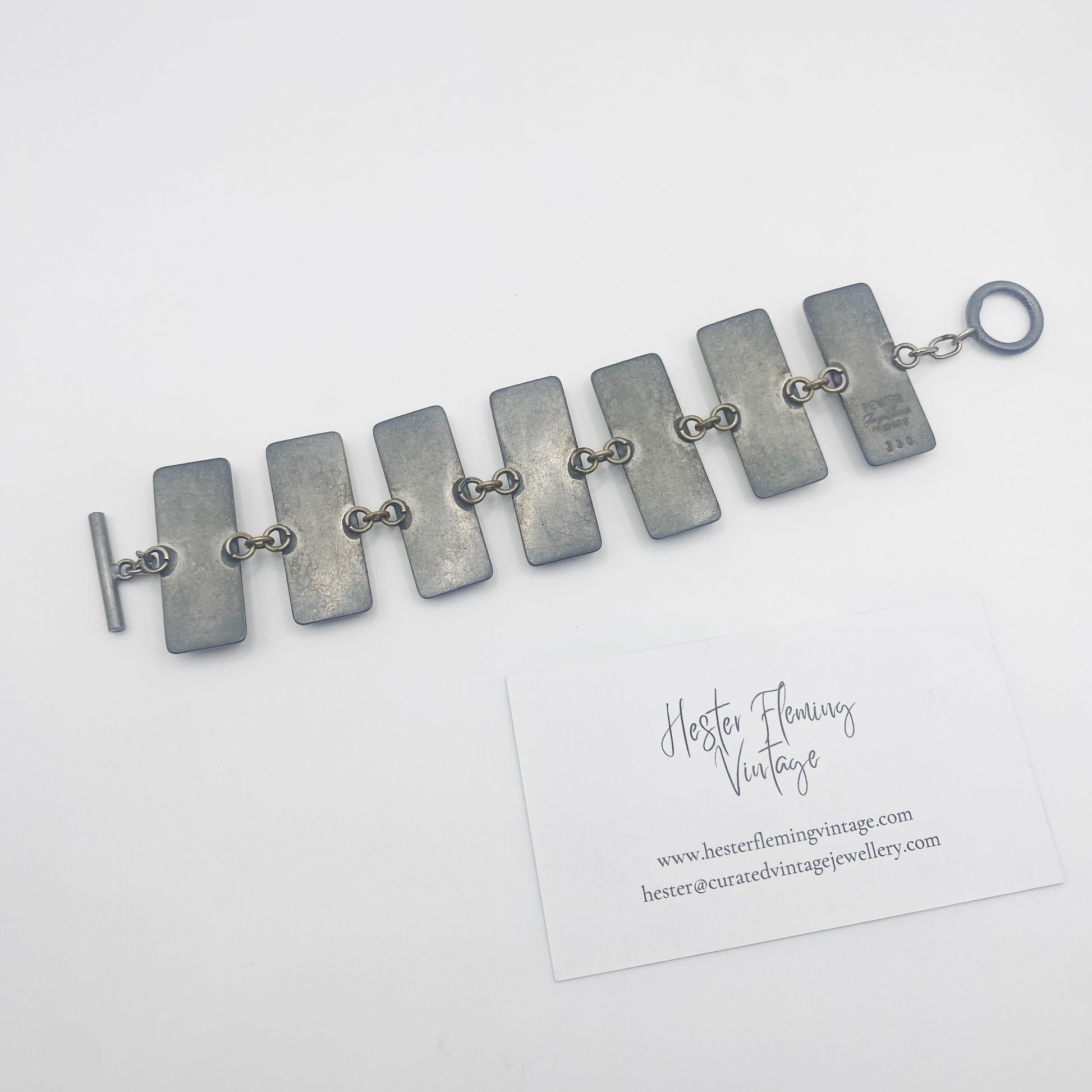 Back view of 1960s Jorgen Jensen bracelet with designer signature. 