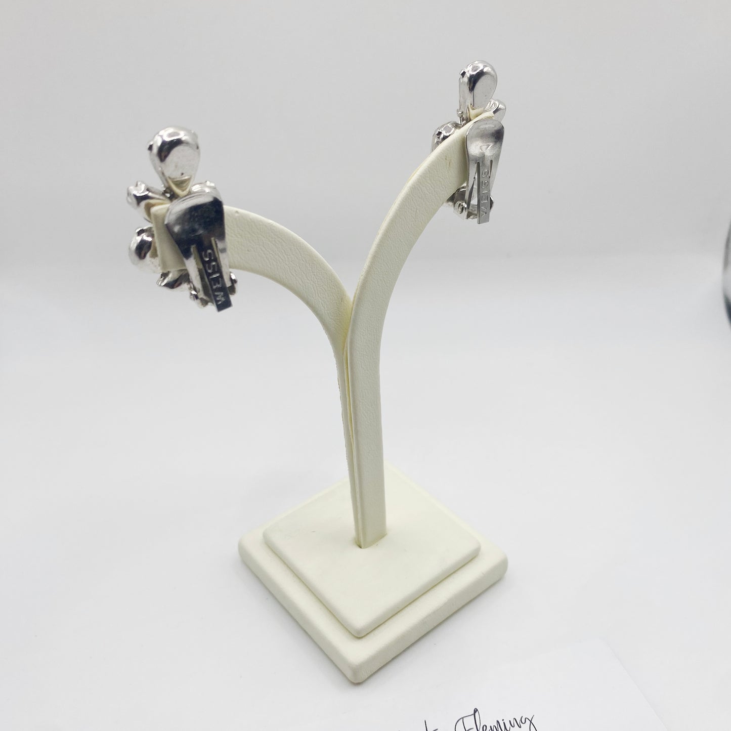 Clip on fitting for 1950s Weiss earrings, on jewellery stand. 