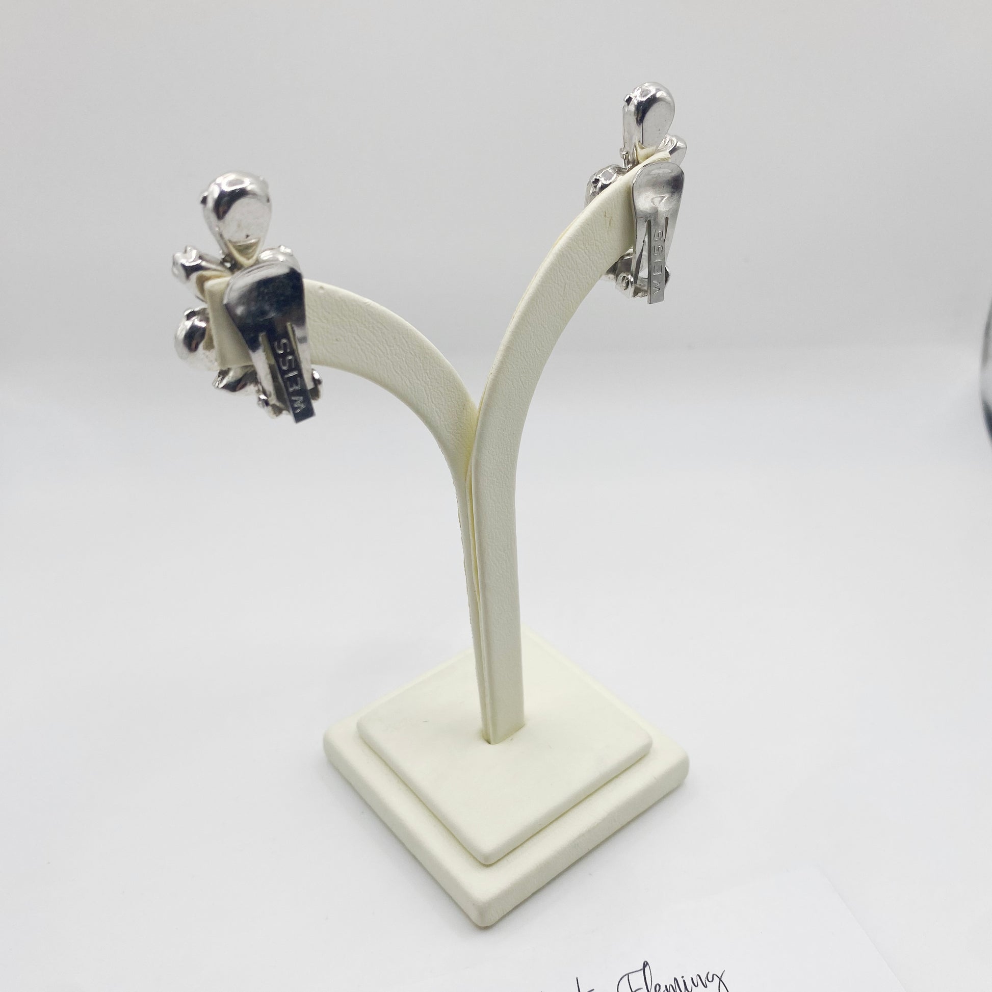 Clip on fitting for 1950s Weiss earrings, on jewellery stand. 