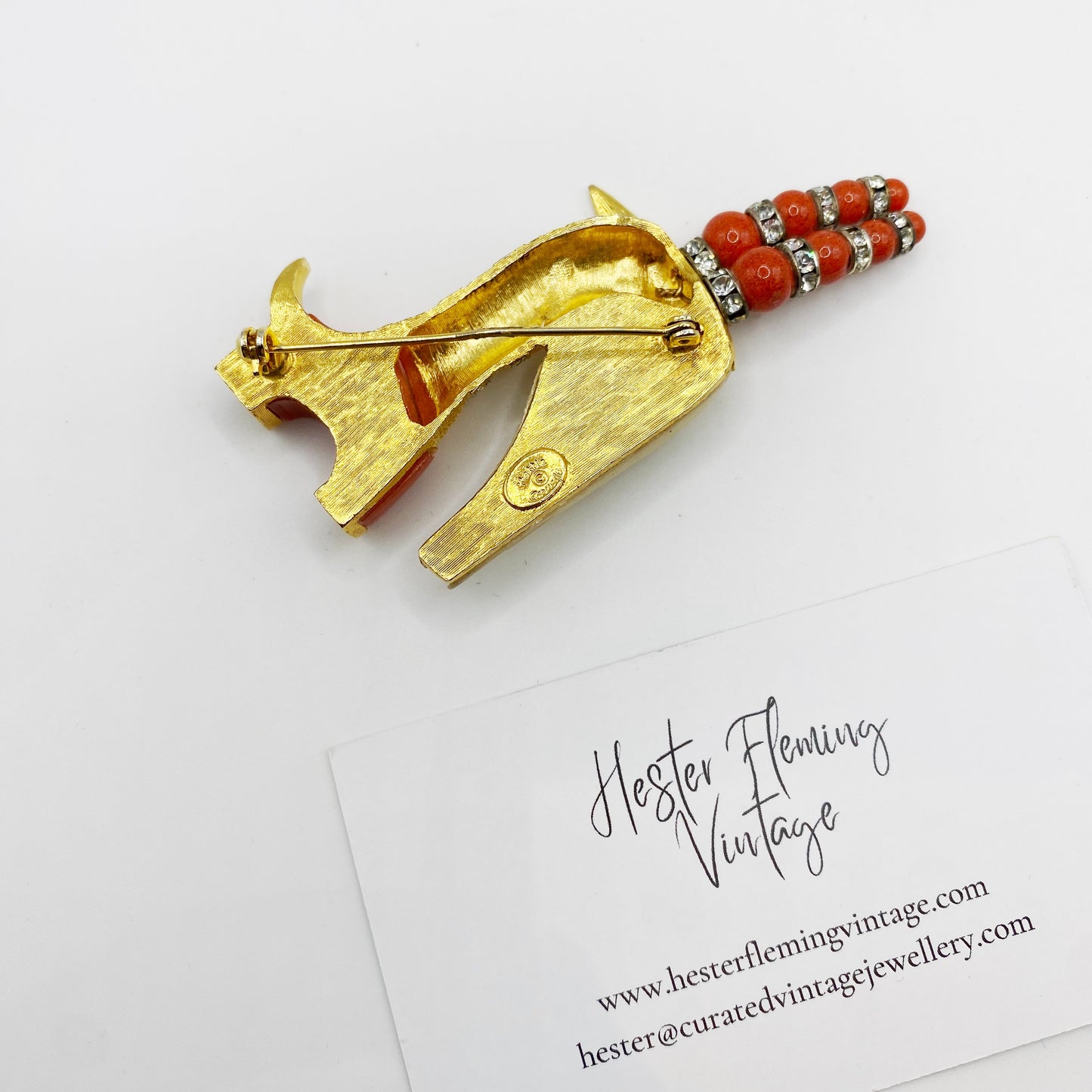 Back view and logo of Hattie Carnegie Capricorn Brooch 