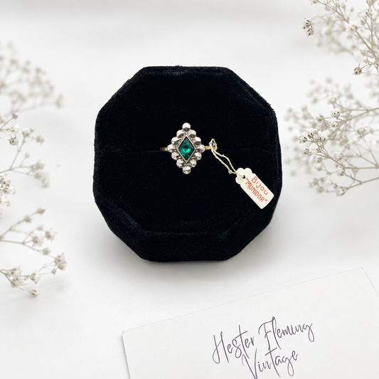 Emerald crystal, rolled gold. Size N. Good vintage condition. Presented on a velvet ring box. 