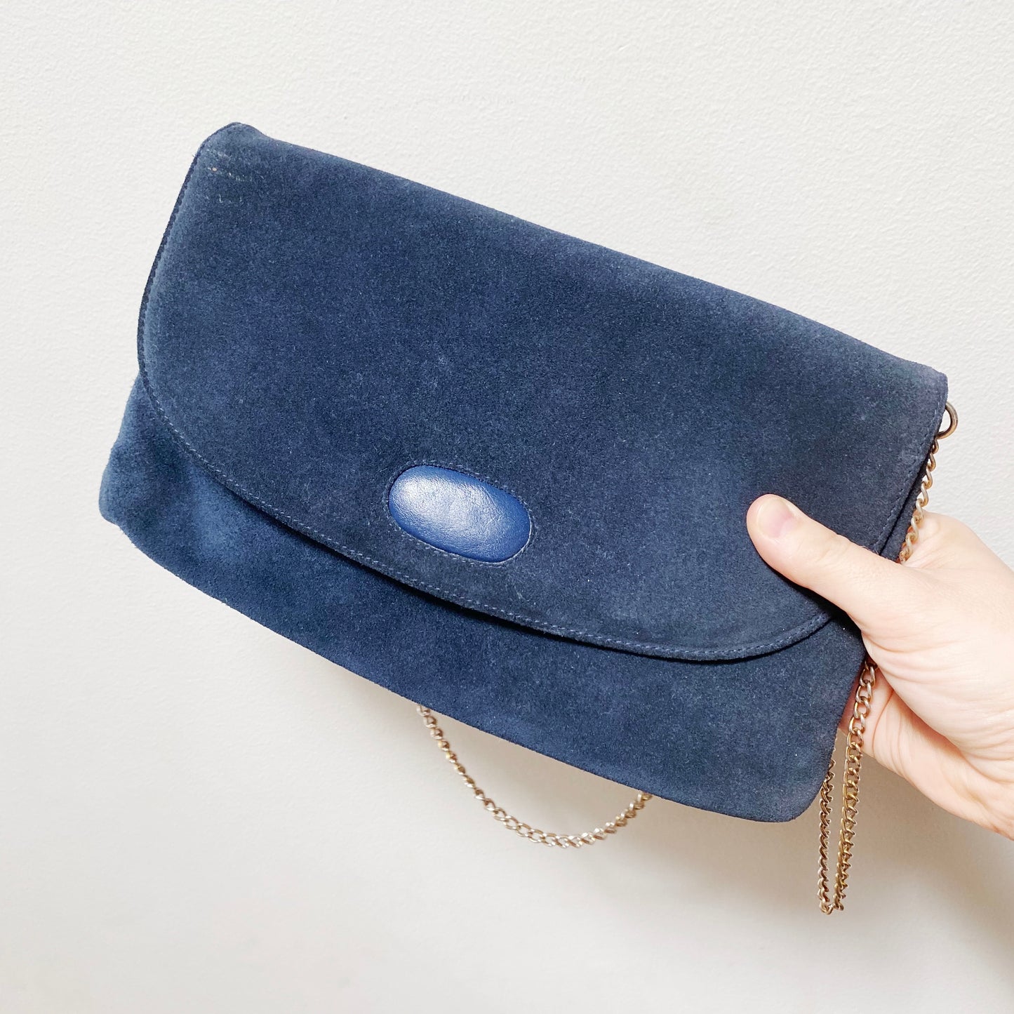 Close up of blue suede vintage bag.