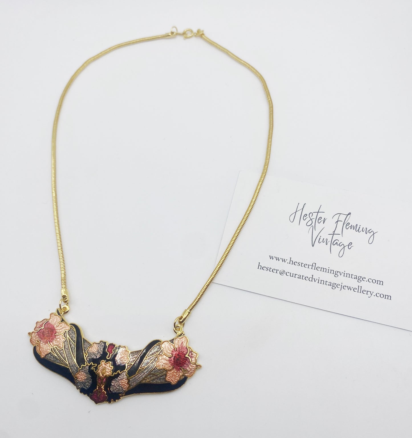 Close up, flat lay of 1980s vintage cloisonne necklace.