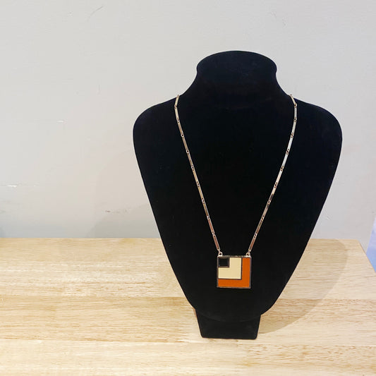 Collectible retro Sarah Coventry necklace, 3cm goldtone enamel square pendant with chain on stand.