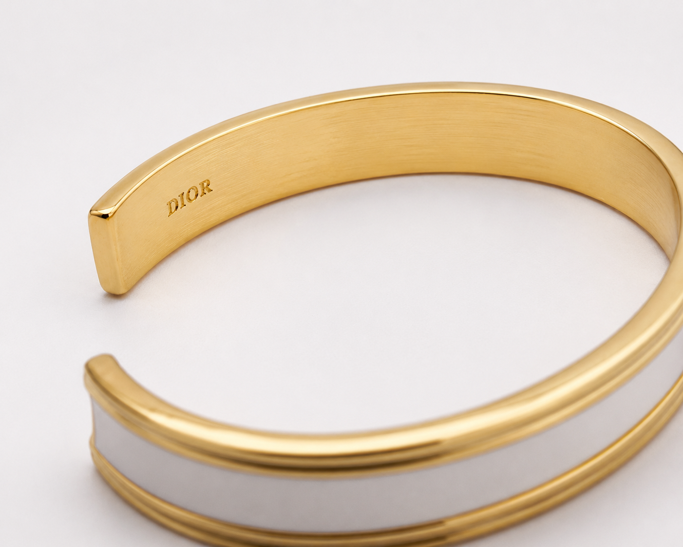 Close up of Dior logo inside bangle.