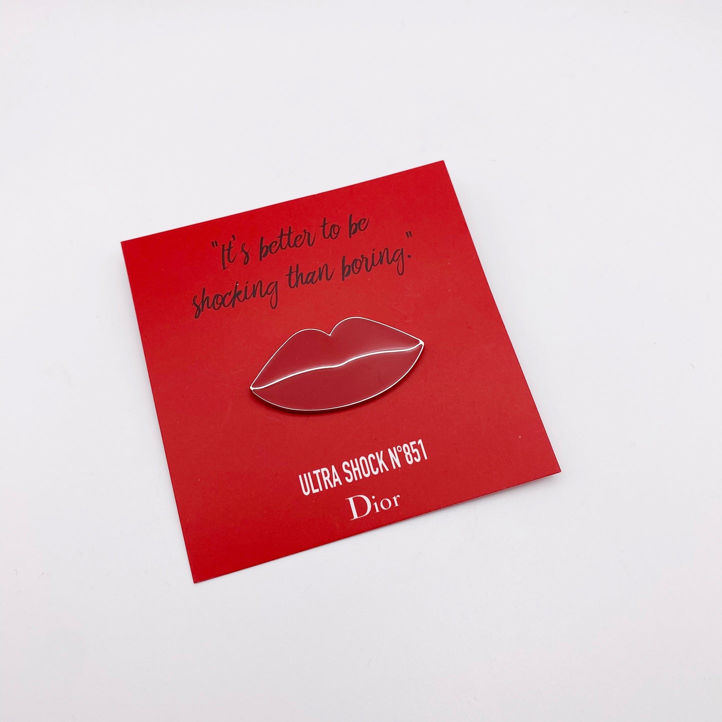 Circa, 2000s. Red enamel lapel pin by Dior. Highly collectable. Part of the Ultra Love N851 lipstick launch.