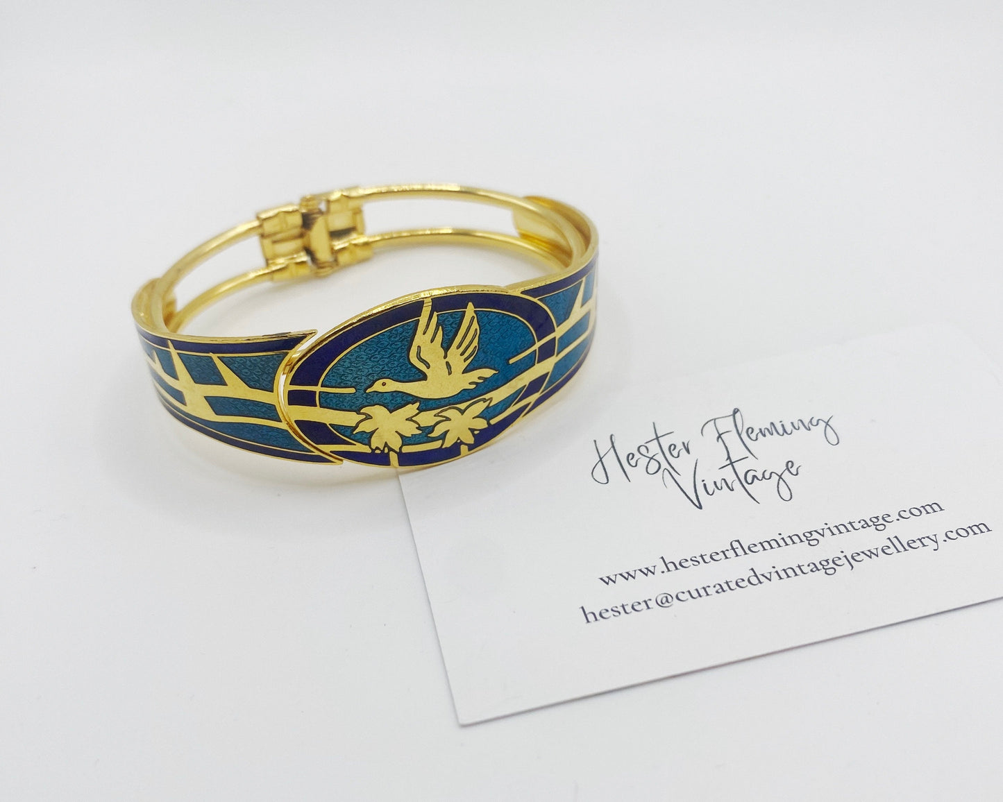 Front view of 80s enamel cloisonne bangle, hinged opening.