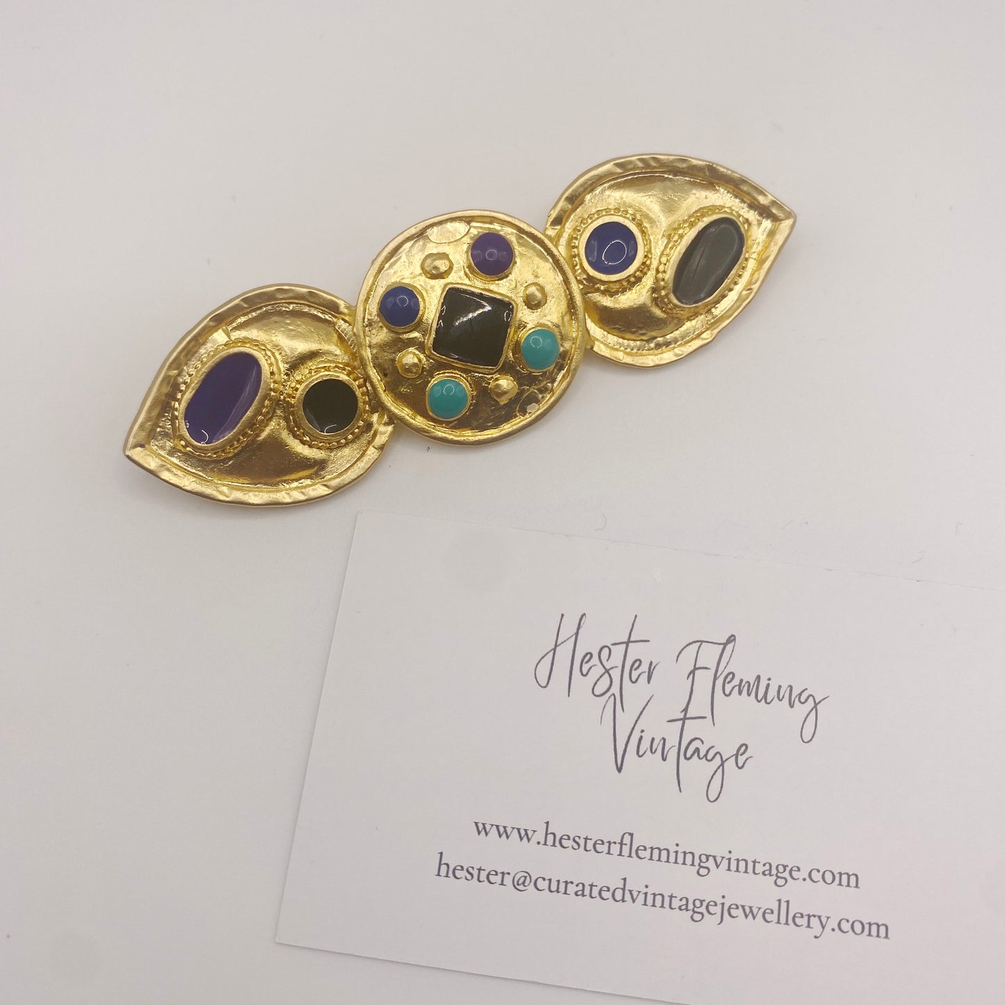 HFV 1980s Egyptian Revival brooch with 22kt gold plating and colorful enamel detailing, vintage costume jewellery statement pin