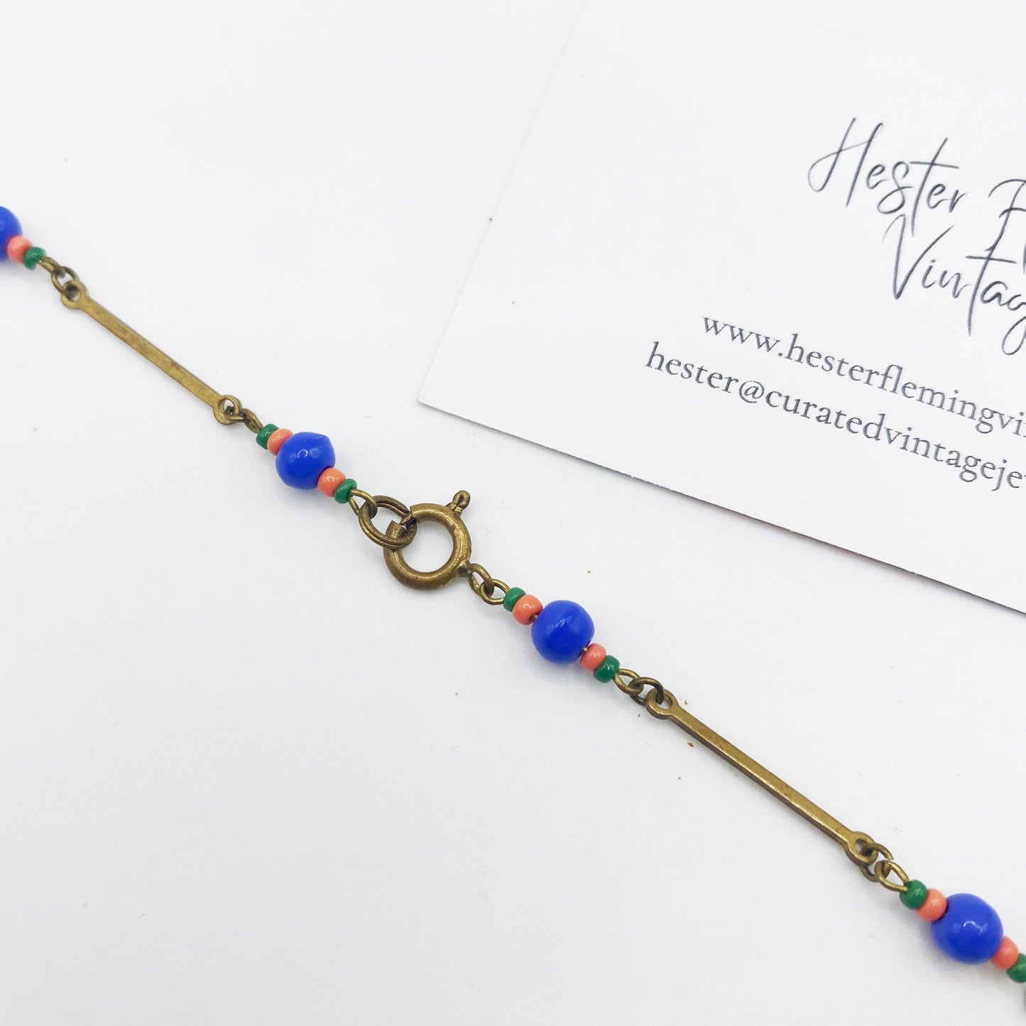 Close up of rolled gold clasp on Czech cobalt glass necklace