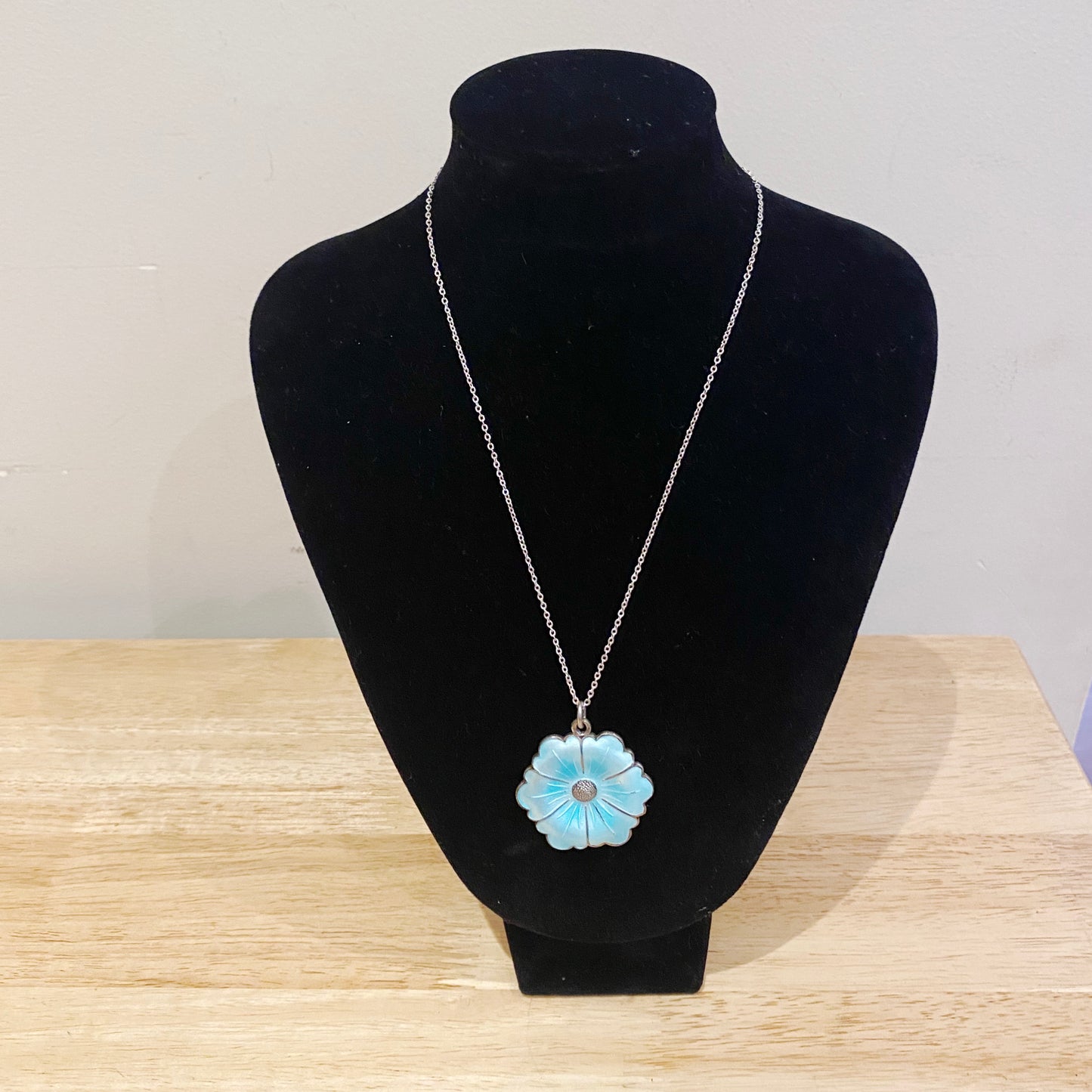 1950s Danish blue enamel pansy pendant shown on jewellery stand as statement mid-century necklace