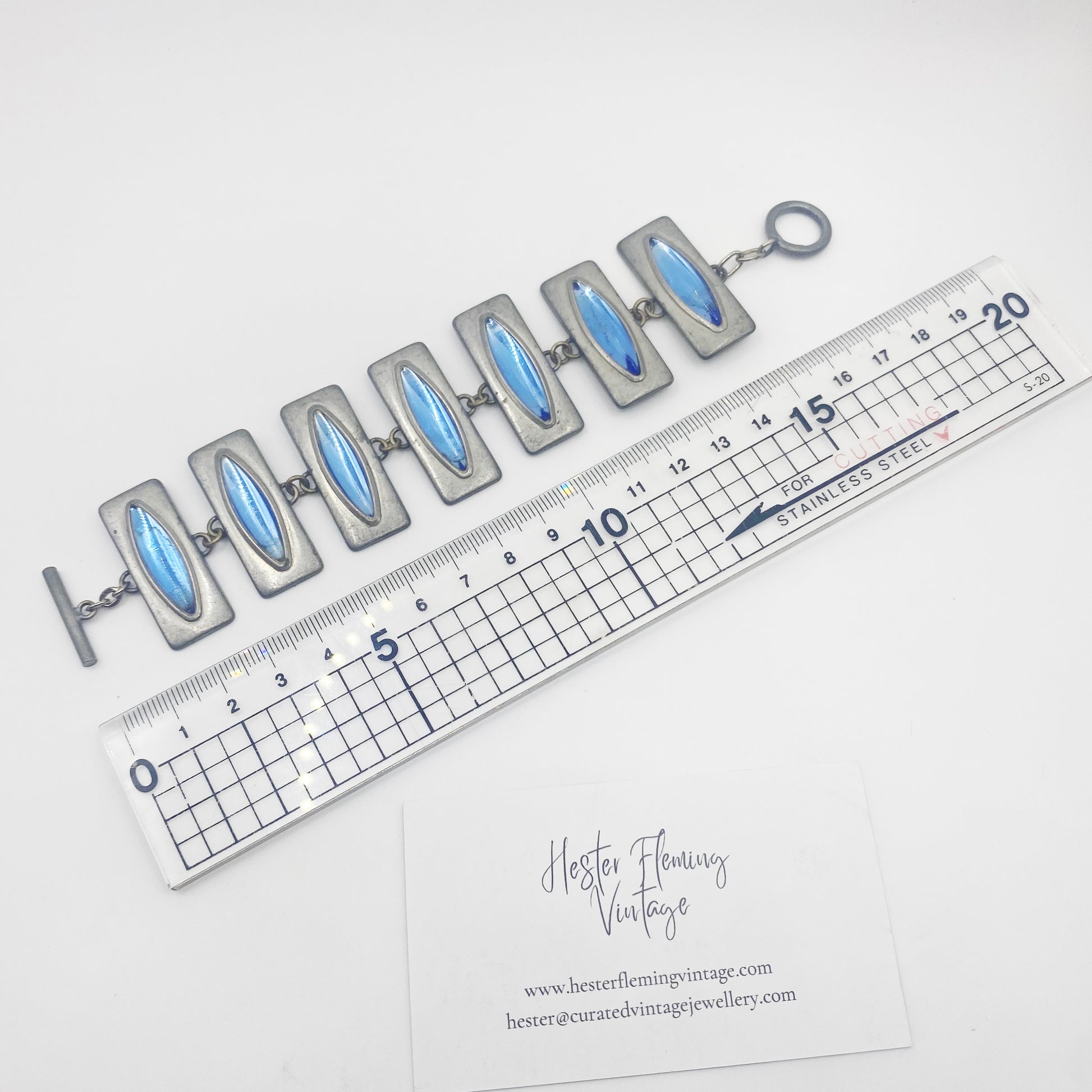 1960s Jorgen Jensen bracelet next to ruler for measurement. 