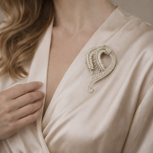 Mid-Century Pennino Brooch, styled on a model wearing a silk top. 