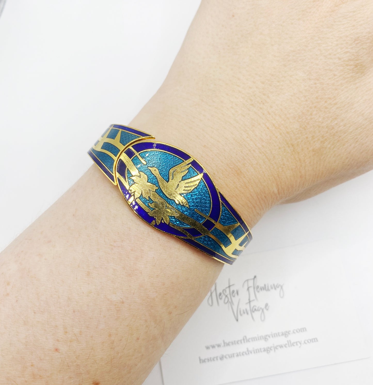 Retro 80s Enamel Cloisonne Bangle, with Swan flying over palm trees. Shown on wrist.