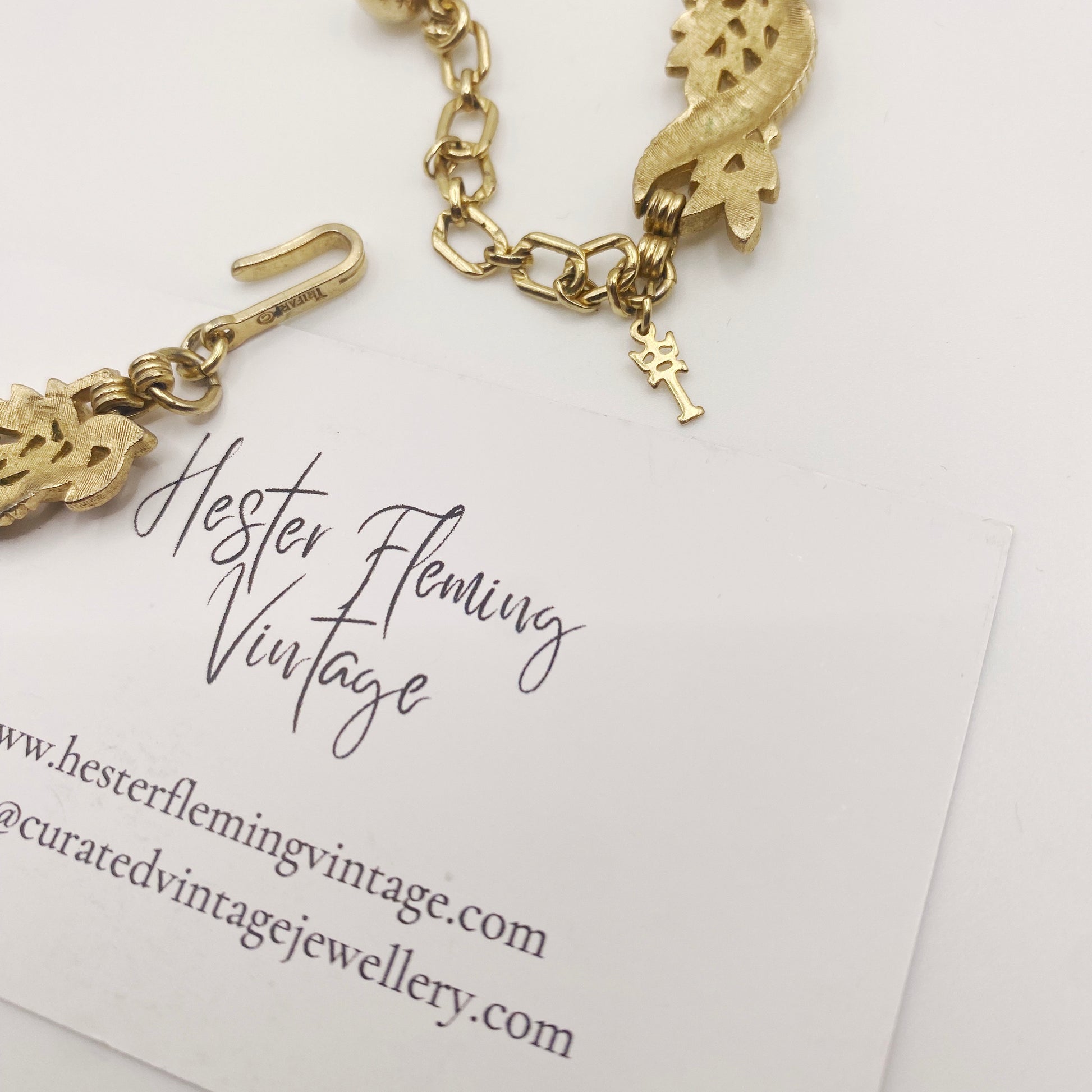 Signed Trifari necklace from the 1950s, showing adjustable clasp detail.