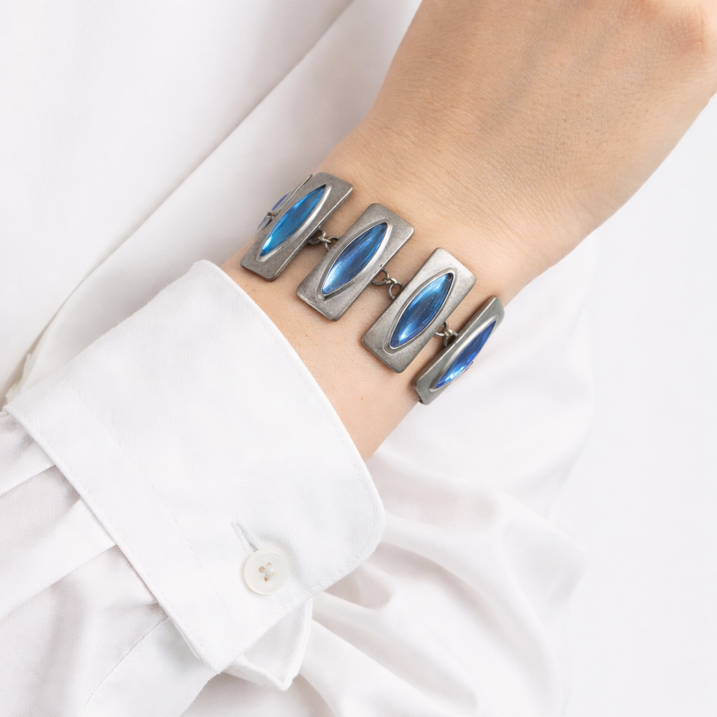 1960s Jorgan Jensen bracelet, styled with a crisp white shirt. 