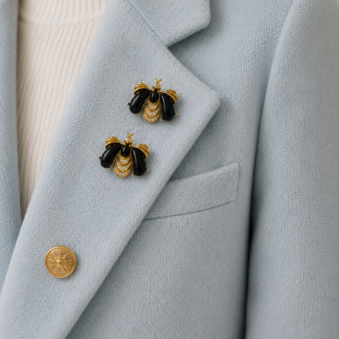 Vintage 1990s Givenchy Bee Brooch Set styled on a light blue cashmere jacket.