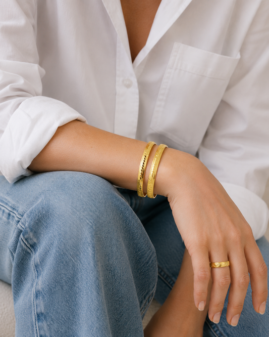 Vintage bangles styled with white shirt and denim jeans. 