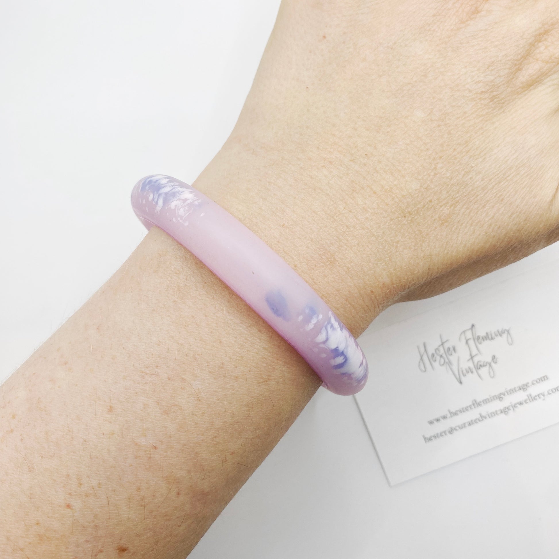 Vintage 80s, pink polymer clay bangle on wrist.