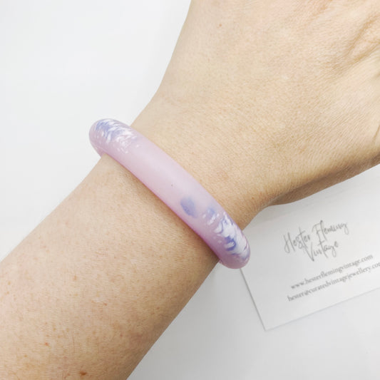 Vintage 80s, pink polymer clay bangle on wrist.